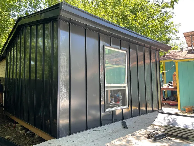 Black standing seam metal wall panels for Metal Roof Installation in World Golf Village