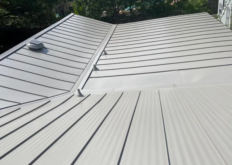 Solar attic fan installed on a metal roof for Roof Ventilation in World Golf Village
